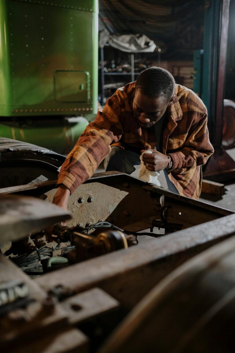 A Man Repairing a Car